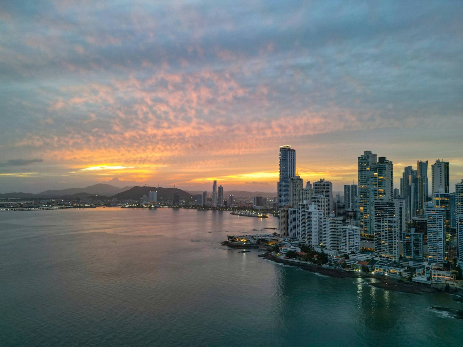The Panama City skyline at sunset, seen across the bay