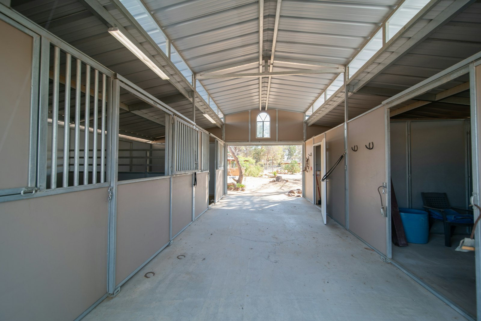 Stable aisle, illustrative of the equestrian facilities at an off-market chalet estate near Porto de M&oacute;s, Leiria